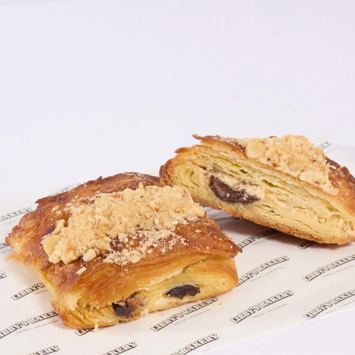 Gluten free praline pain au chocolat on a white background