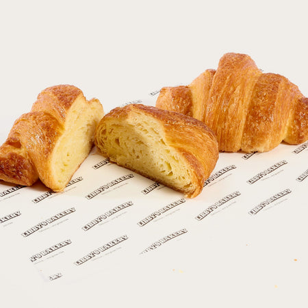 Libby's gluten free croissants, one cut open to show the flaky layers