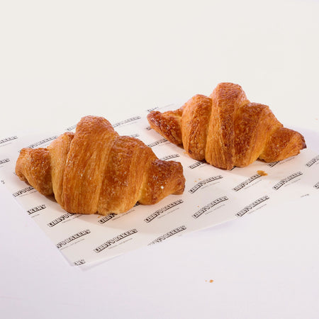 Two Libby's gluten free croissants on Libby's branded paper