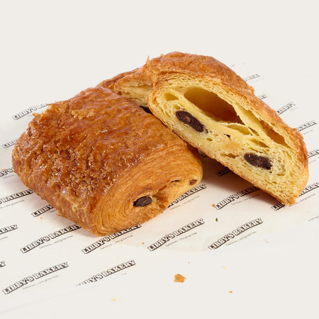 Libby's gluten free pain au chocolat cut open to show the chocolate and layers
